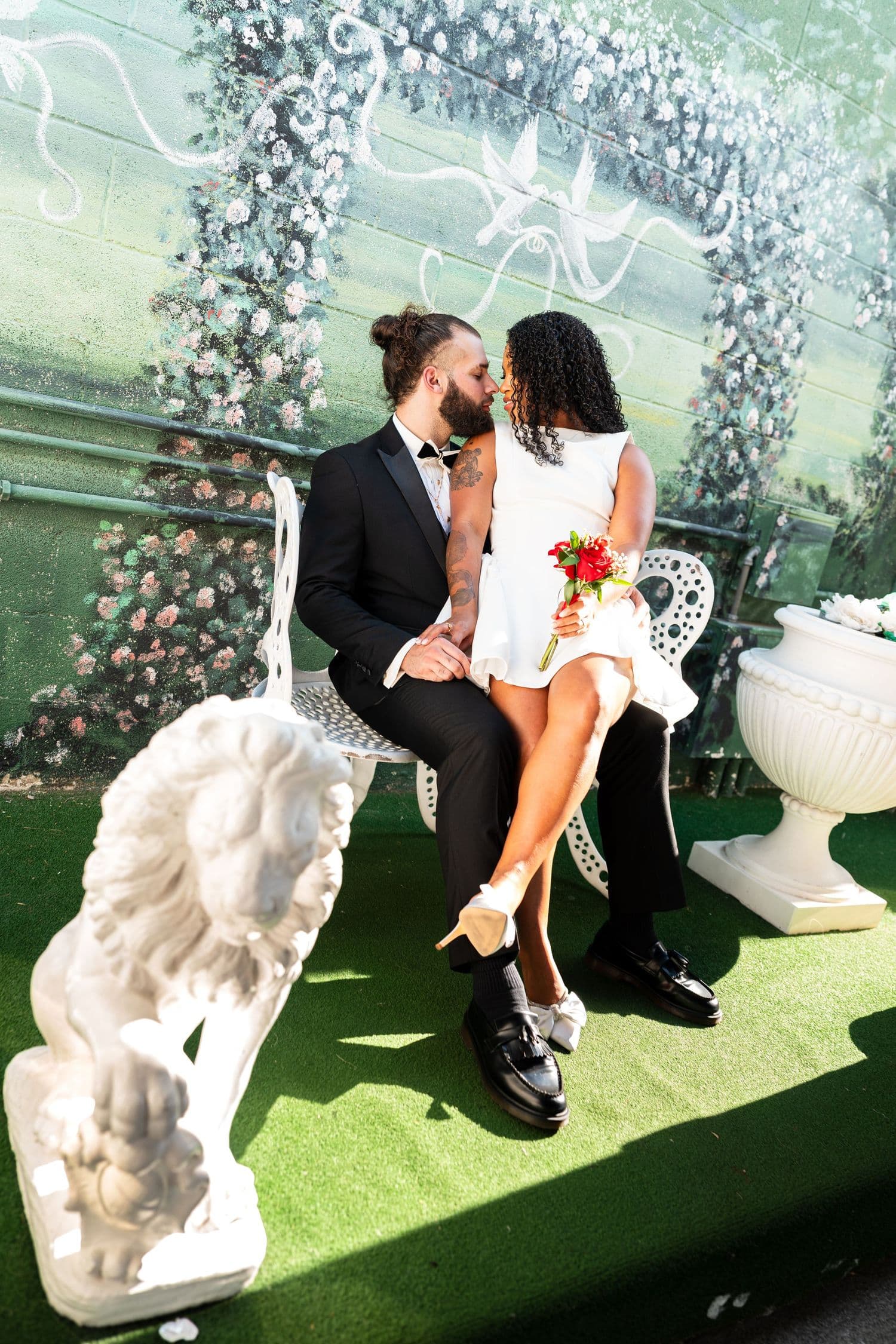 Couple under a floral arch